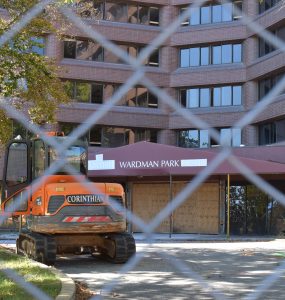 A construction vehicle sits outside the boarded up entrance of the Wardman Park Hotel