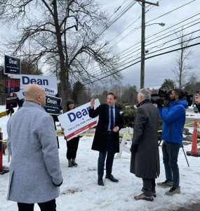 Dean Phillips with people campaigning for him outside a New Hampshire precinct on election day.